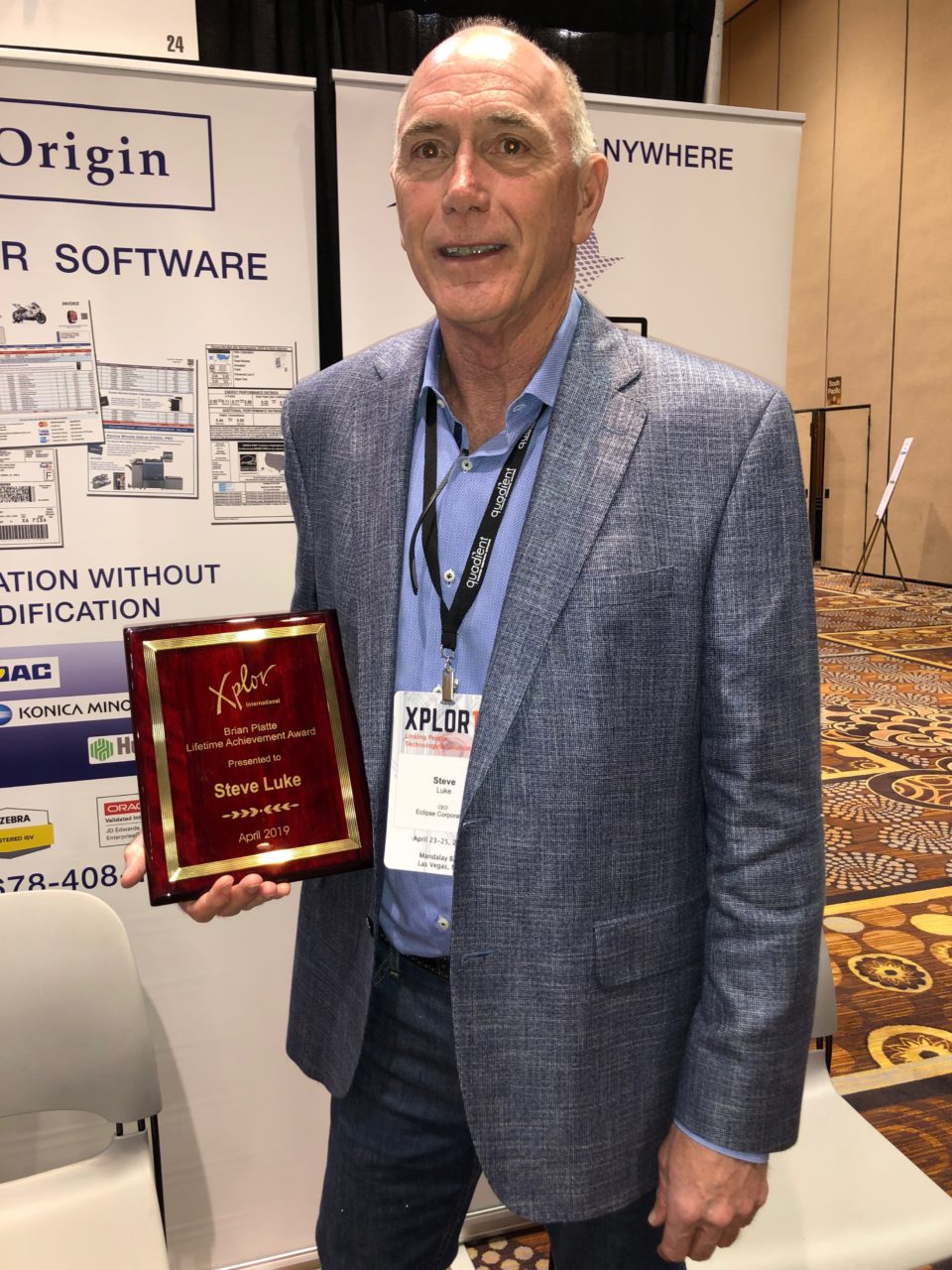 Steve Luke, Founder and CEO of Eclipse Corp displays the Brain Platte Lifetime Achievement Award he received at Xplor 19